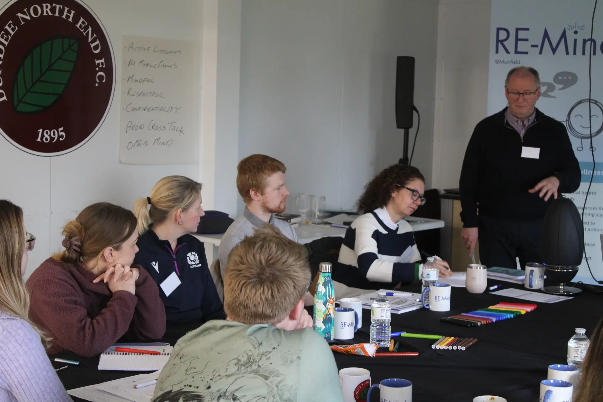 Jim Gibbon leading an in-person Re-Mind workplace mental health training session.